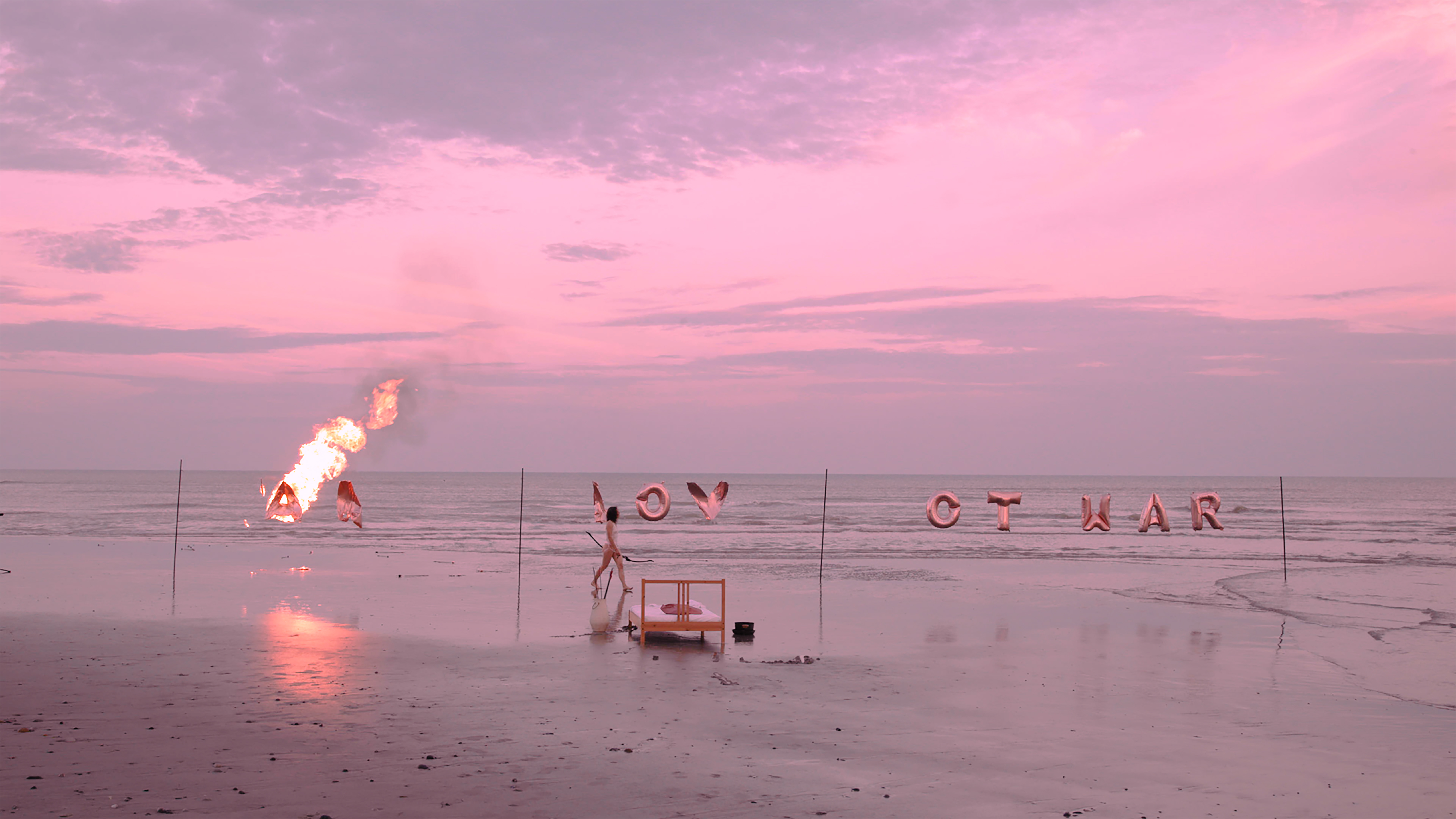Make Love Not War — fire on the beach